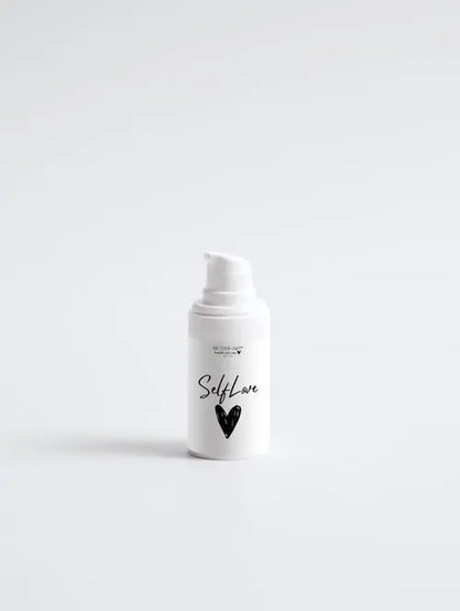 acne spot care serum in a white bottle labeled SelfLove for quick treatment of unwanted breakouts.