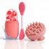 Set of pink grooming tools including a brush, scrubber, and container on a white background